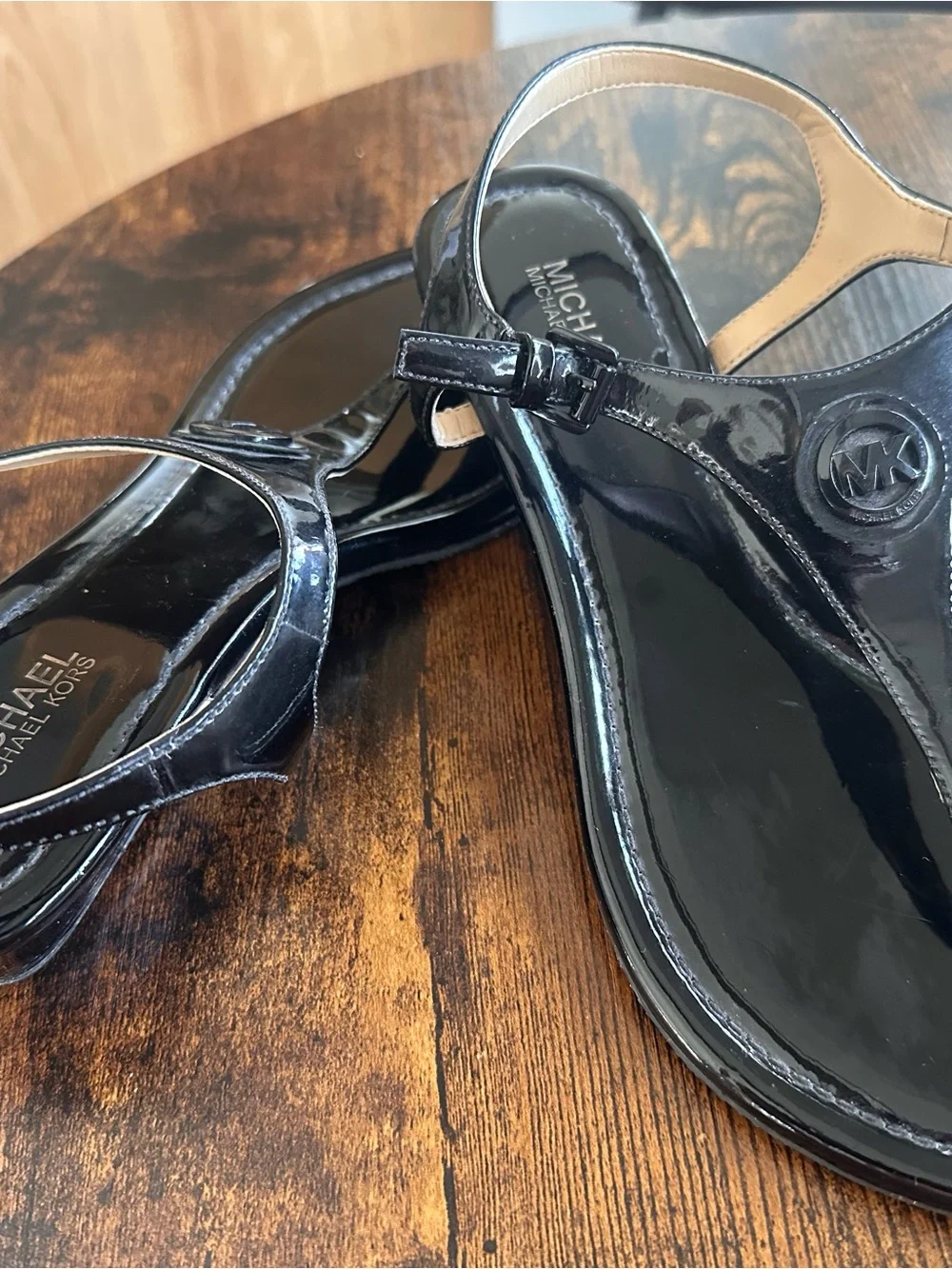 Michael Kors Black Patent T-Strap Sandals with Logo Medallion